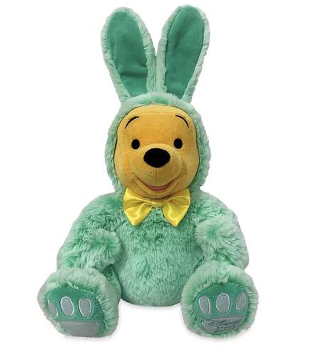 a plush doll toy of Winnie the Pooh, dressed up as a mint green rabbit.  real ones know the reference.
