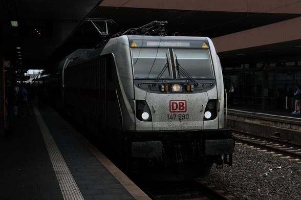 a slightly dirty white intercity train from the bahn standing in duesseldorf central station