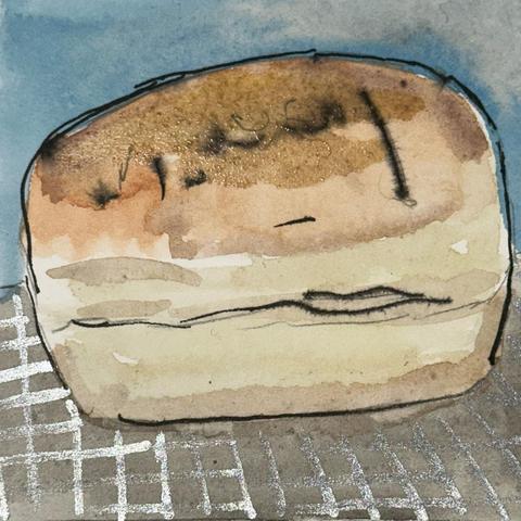 A golden loaf of freshly baked bread.