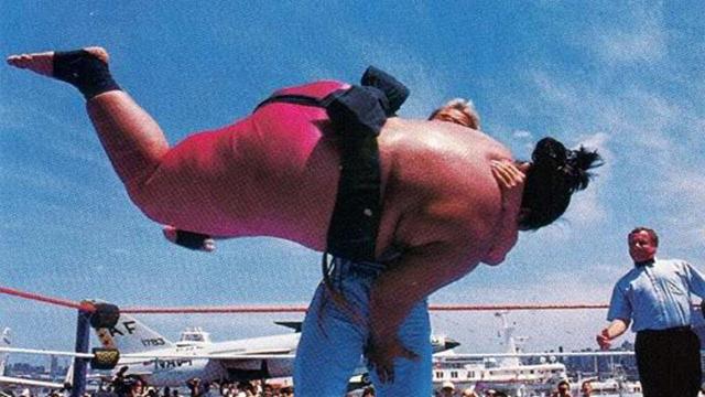 Wwf match. lex Luger, a muscular professional wrestler body slamming Yokozuna, a near 600 pound professional wrestler