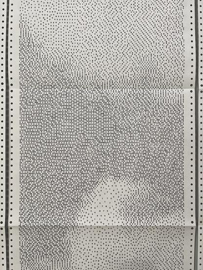 A closeup of one strip of paper with arrangements of numbers.