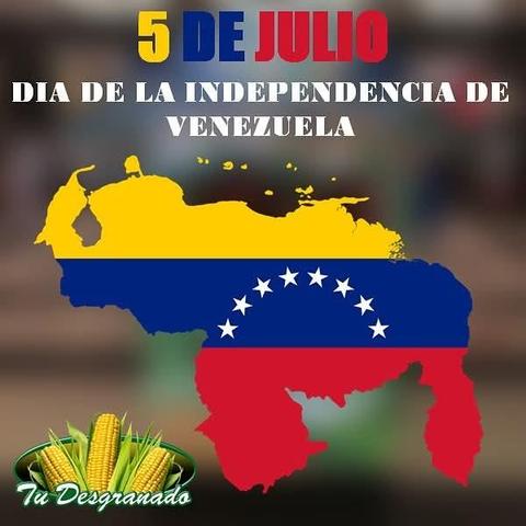 La imagen conmemora el 5 de Julio, el Día de la Independencia de Venezuela. Presenta un mapa del país con los colores de la bandera venezolana y el texto "5 DE JULIO DIA DE LA INDEPENDENCIA DE VENEZUELA". En la esquina inferior izquierda se observa un logo verde con mazorcas de maíz y la leyenda "Tu Desgranado".