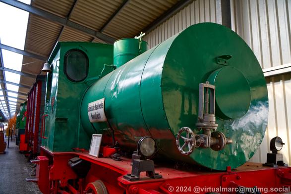 A photo of a green steam locomotive of the "Süddeutsche Kabelwerke Mannheim" (South German Cable Works Mannheim).