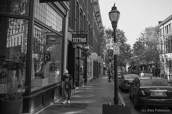 Exchange St.
Portland, Maine

Woman walking, cars parked, stores in a quaint street in B&W