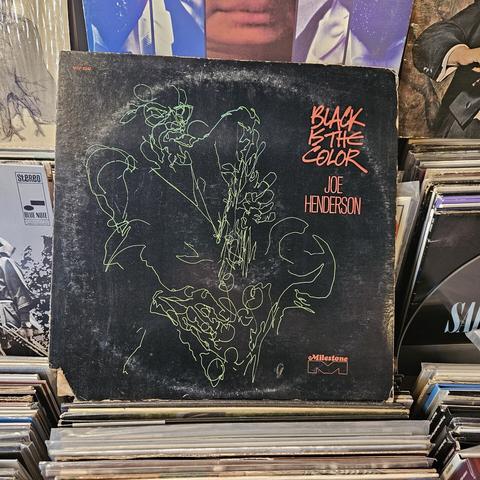 Black album cover features an abstract line drawing in green of Joe Henderson, playing the saxophone.