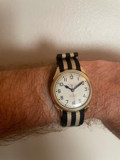it’s the new (to me) bulova accutron railroad approved 214. It has a gold-fill case, white face with plain numerals, and blued steel hands with a red seconds hand