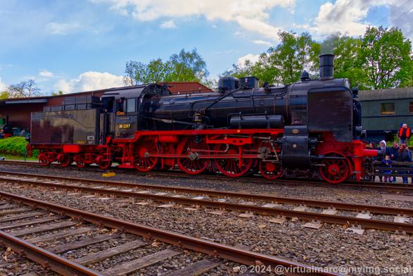 A photo of the P01 steam locomotive, waiting for passengery to drive. It has the number 38 2267.