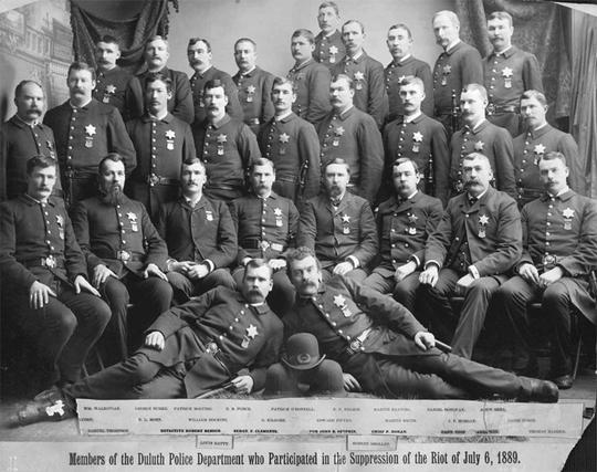 The Duluth cops who were involved in the gun battle that killed the striking construction workers, posing in 3 rows.