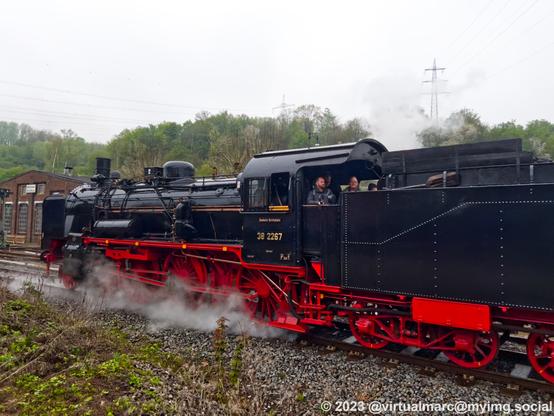 A photo of a steam locomotive, the P1, with the number 38 2267 driving backwards.