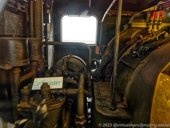A photo from inside the engine room of a locomotive through a window.