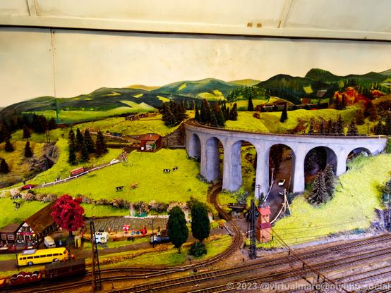 A photo of a model railway with a viadukt.