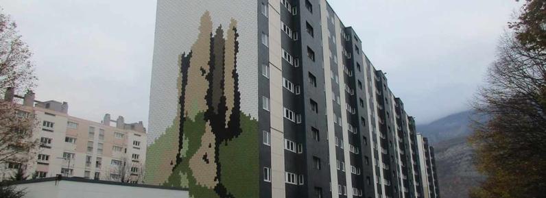 Finished building with artful cladding