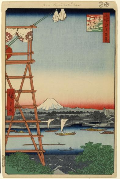 The left quarter of the frame shows a bamboo small tower, perhaps a viewing platform. The view beyond is water with sailboats, snow covered Fuji, and sunset.