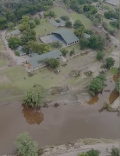 View of a camp where buildings have been swept away
