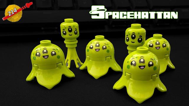 Man sieht eine Ansammlung limettengrüner Aliens, die freundlich in die Kamera lächeln. Die Aliens sind aus Klemmbausteinen zusammengesteckt.