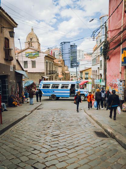 A street in La Paz, where a blue bus is passing through