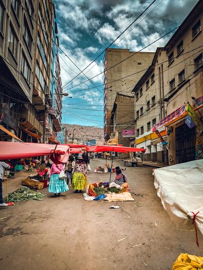 A set of women are selling goods in the streets of Bolivia