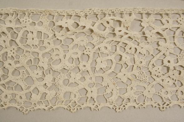 Close up of the Flemish lace, showing a very intricate webbed pattern.