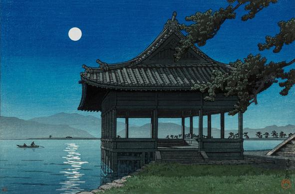A full moon rises in a starless night sky, casting bright cold light over the Kankai-kaku pavilion, standing on the beach in Wakayama. Out in Wakanoura Bay, a pilot guides a small wooden boat with a single passenger across the calm water. Beyond, the shadowy shapes of low mountains cross the horizon.