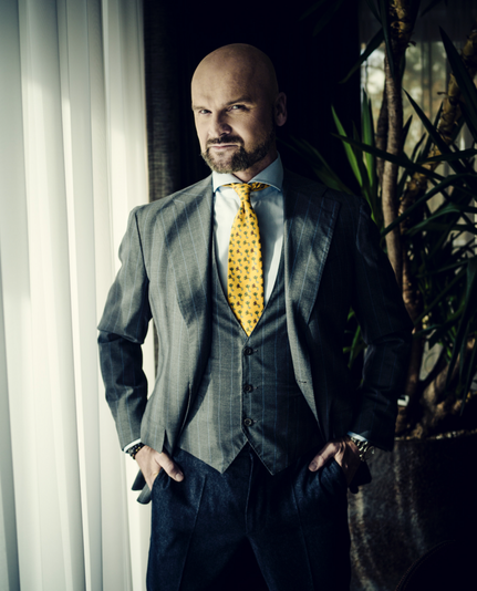 rafał brzoska, another dipshit billionaire, stares directly at the camera. caution! he's the spit of anton lavey & his eyes are filled with malice. look away. do not hold this man's gaze.