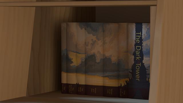 A screenshot from VRChat showing a modern, realistically lit bookshelf filled with books. This is a close-up zooming in on a specific stack showing a custom artwork cover for The Dark Tower series.