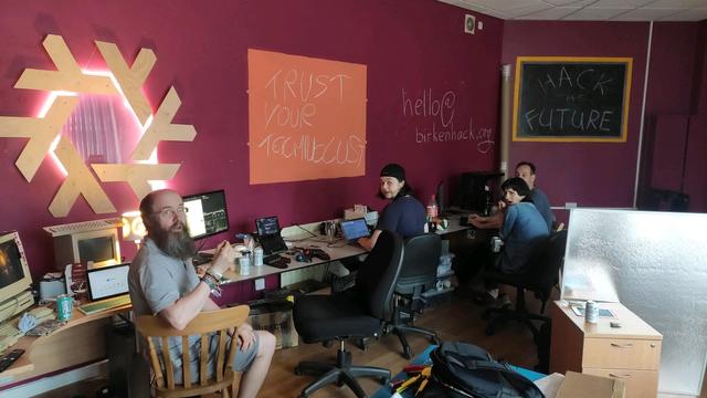 4 Birkenhack members shocked by the photographer shouting "cheese", they are all turned to face the camera with varying degrees of shock