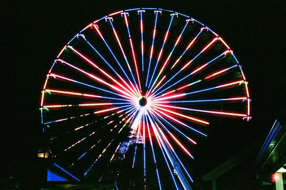 A very tall and brightly lit Ferris wheel located at "Broadway At The Beach" in Myrtle Beach, South Carolina.