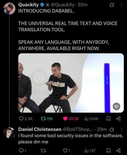 The image is a screenshot of a Twitter post by a user named Quackity, featuring a promotional tweet about a product called DABABEL. The tweet reads: "INTRODUCING DABABEL. THE UNIVERSAL REAL TIME TEXT AND VOICE TRANSLATION TOOL. SPEAK ANY LANGUAGE, WITH ANYBODY, ANYWHERE. AVAILABLE RIGHT NOW." Below the text, there is an image of two men sitting on stools, with one holding a smartphone. The man on the right is wearing a black t-shirt with the text "CAMPO REAL SOCCER" on it. The background is white with a logo partially visible. The tweet has garnered significant engagement, with 39.5K likes, 19K retweets, and 2.3K comments. Below the tweet, there is a reply from a user named Daniel Christensen, who mentions finding security issues in the software and requests a direct message. The reply has 1 like and 137 retweets.