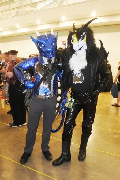 Two dragon fursuiters at the dragon meet at Anthrocon.  Left is Drakl, the scalemail dragon. Right is Terry the goth/punk dragon sporting PVC jeans.