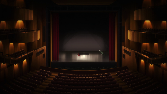 An indoor theater, with parterre and box seats, dimly lit. The curtain is open. The stage has a hole in the distant part, signalled by a red cone. A blonde man is entering the stage floating from the right wings.