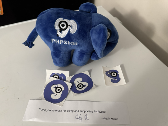 Blue php elephant plush with dark blue php Stan stickers on a white background