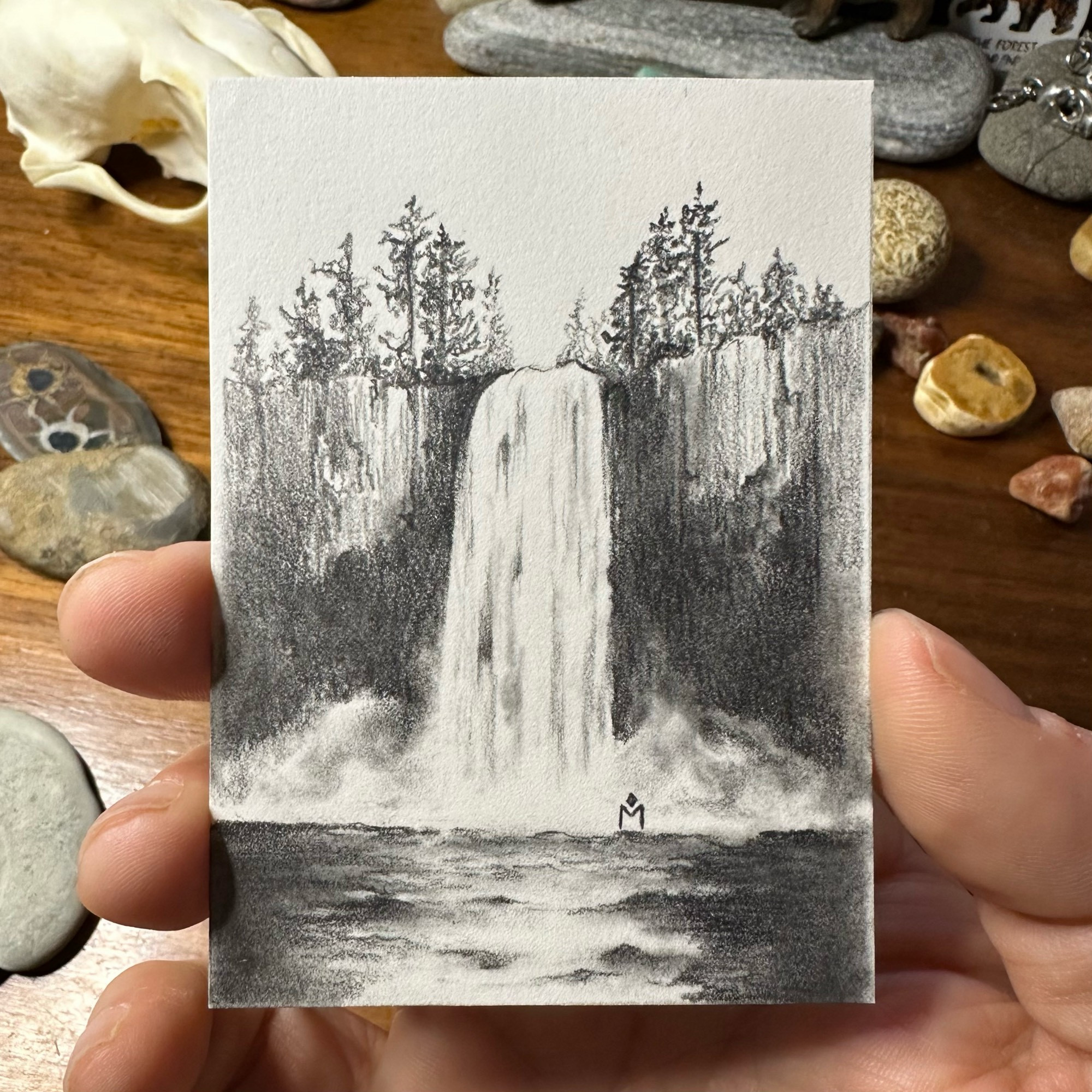 Small pencil drawing of a waterfall