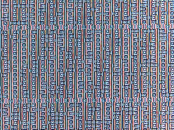 A fragment of a mask-programmed ROM, with bits clearly visible. Bits are formed by the presence/absence of an active region of MOSFET transistors.