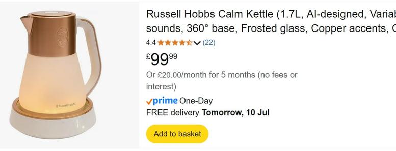 A rather fancy-looking, but overpriced kettle, sitting on its stand.

"Russell Hobbs Calm Kettle (1.7L, Al-designed, Variable sounds, 360° base, Frosted glass, Copper accents."