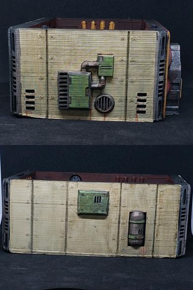 Opposite side and back view of the same building. Industrial panels are painted in metallic and green against the grubby cream panels.