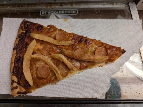 America Pizza, complete with hot dogs and fries.