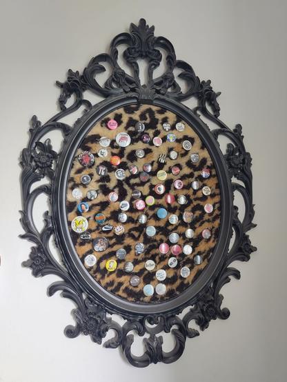 ikea frame, but instead of a picture i put in some leo fur and some buttons in it