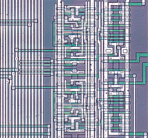 Two sets of transistors drive common bus lines, controlled by the port I/O circuitry.