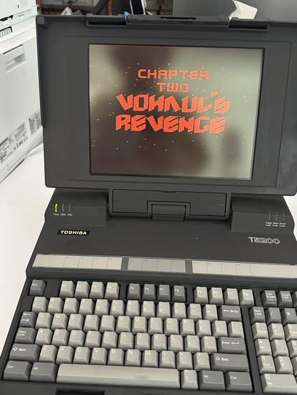 Toshiba laptop from the 1980s with a plasma display launching Space Quest II