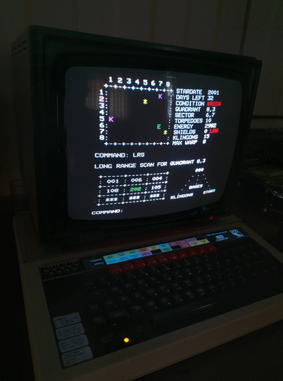Photo of my Cub monitor sitting on top of my BBC Micro. It is showing my Super Star Trek game running.