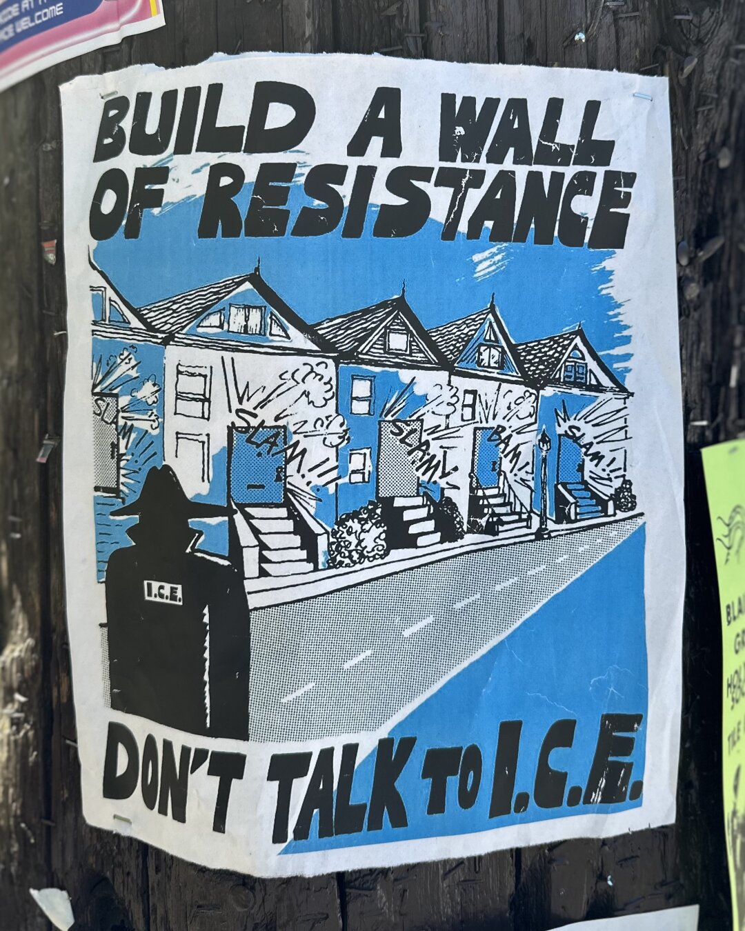Black and blue poster: “Build a wall of resistance. Don’t talk to ICE”