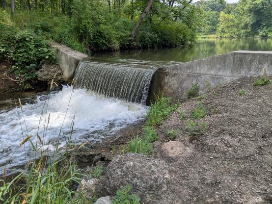 Small waterfall over a concrete dam