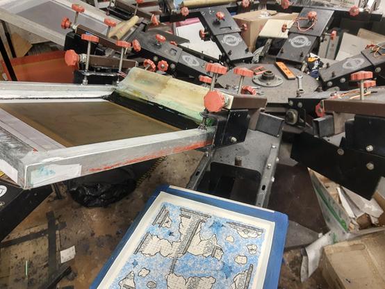 Standing from the printer's perspective, printing this map layer by layer with ink and squeegees