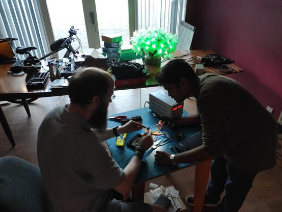 two birkenhackers wiring up the 32x32 LED panel on a worktable