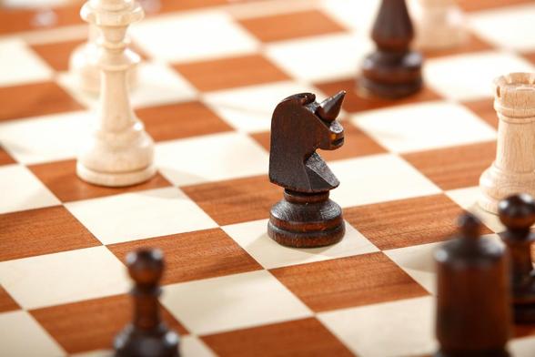 horse chest piece on chess board