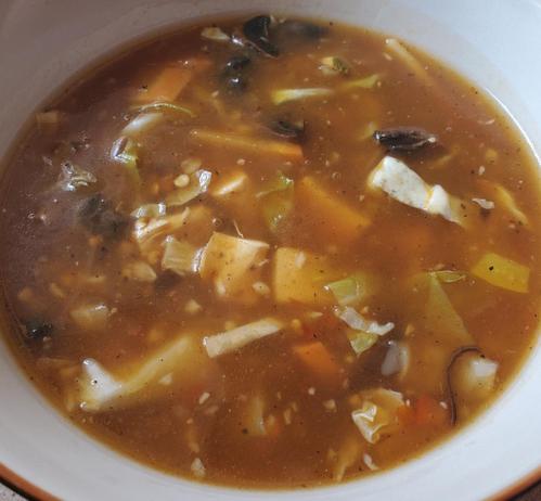 A bowl of Himalayan hot n sour chicken & vegetables soup