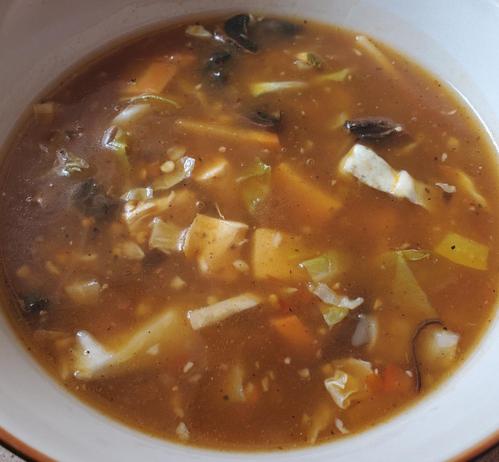 A bowl of Himalayan hot n sour chicken & vegetables soup