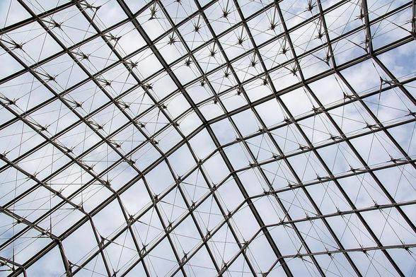 The Louvre Pyramid, an architectural wonder in Paris, France rises proudly above you in all its glory.