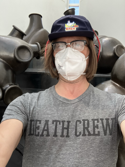 Wearing a mask in SeaTac airport in front of art installation