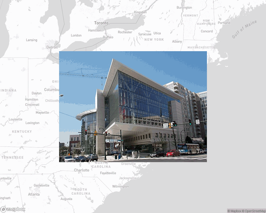 A photo of or from a library from the linked website, overlaid on a cropped world map where it's located.